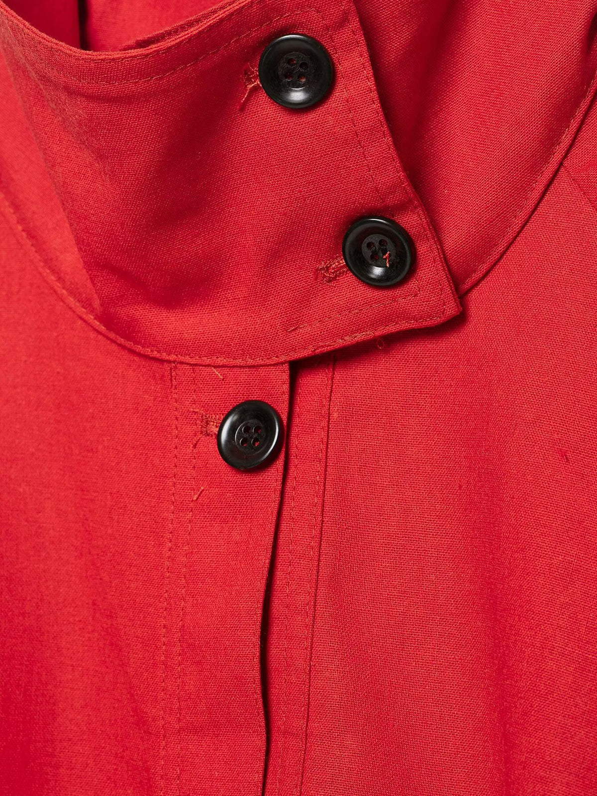 Red stand collar jacket fabric detail
