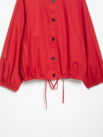 Red stand collar jacket closure detail